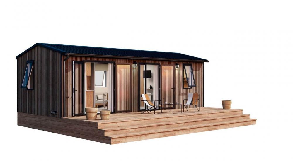 Mobile home façade with wood-effect finish, large windows, and covered terrace